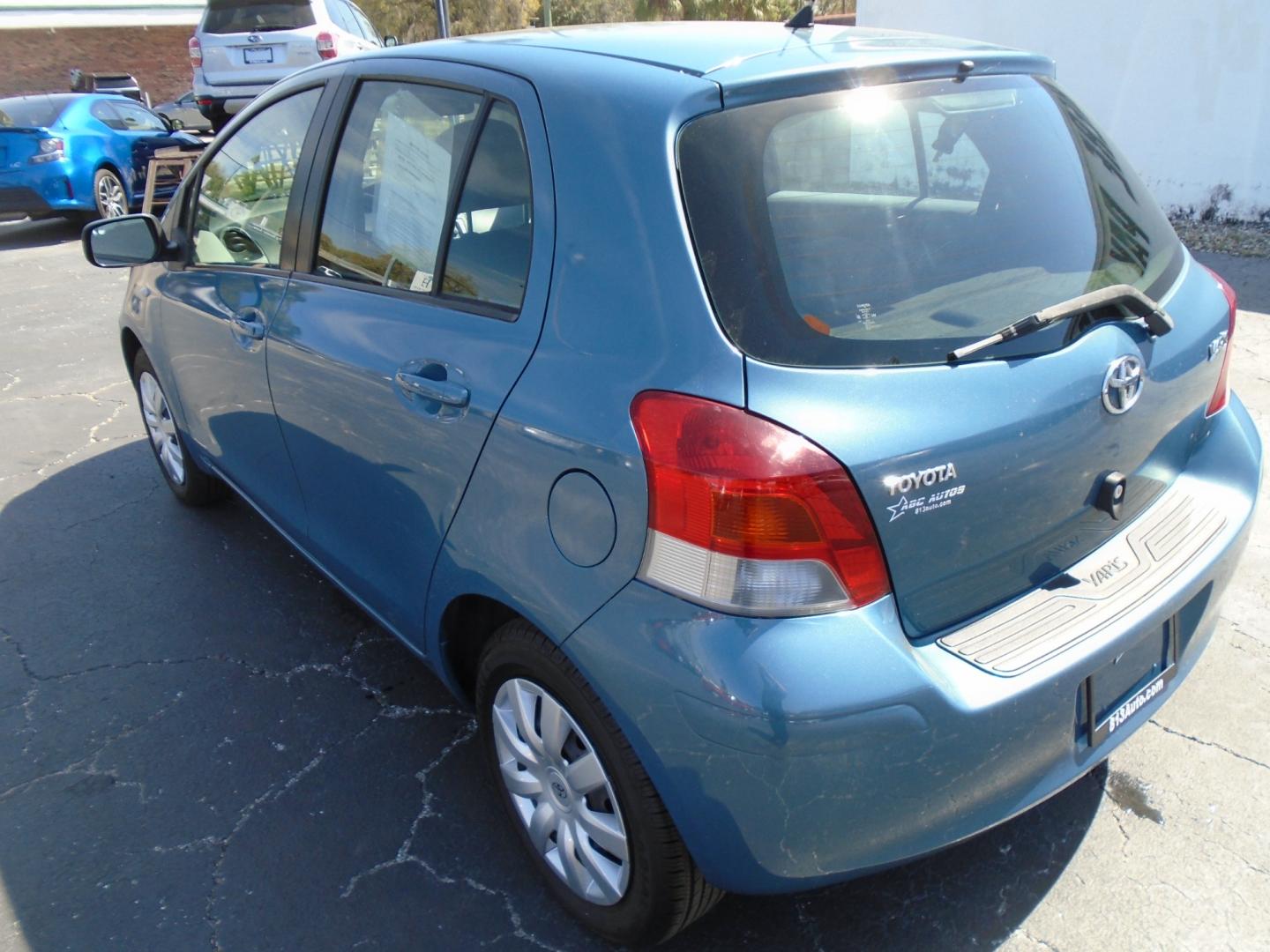 2010 BLUE /Grey Toyota Yaris Liftback 5-Door AT (JTDKT4K39A5) with an 1.5L L4 DOHC 16V engine, 4-Speed Automatic transmission, located at 6112 N Florida Avenue, Tampa, FL, 33604, (888) 521-5131, 27.954929, -82.459534 - Photo#4